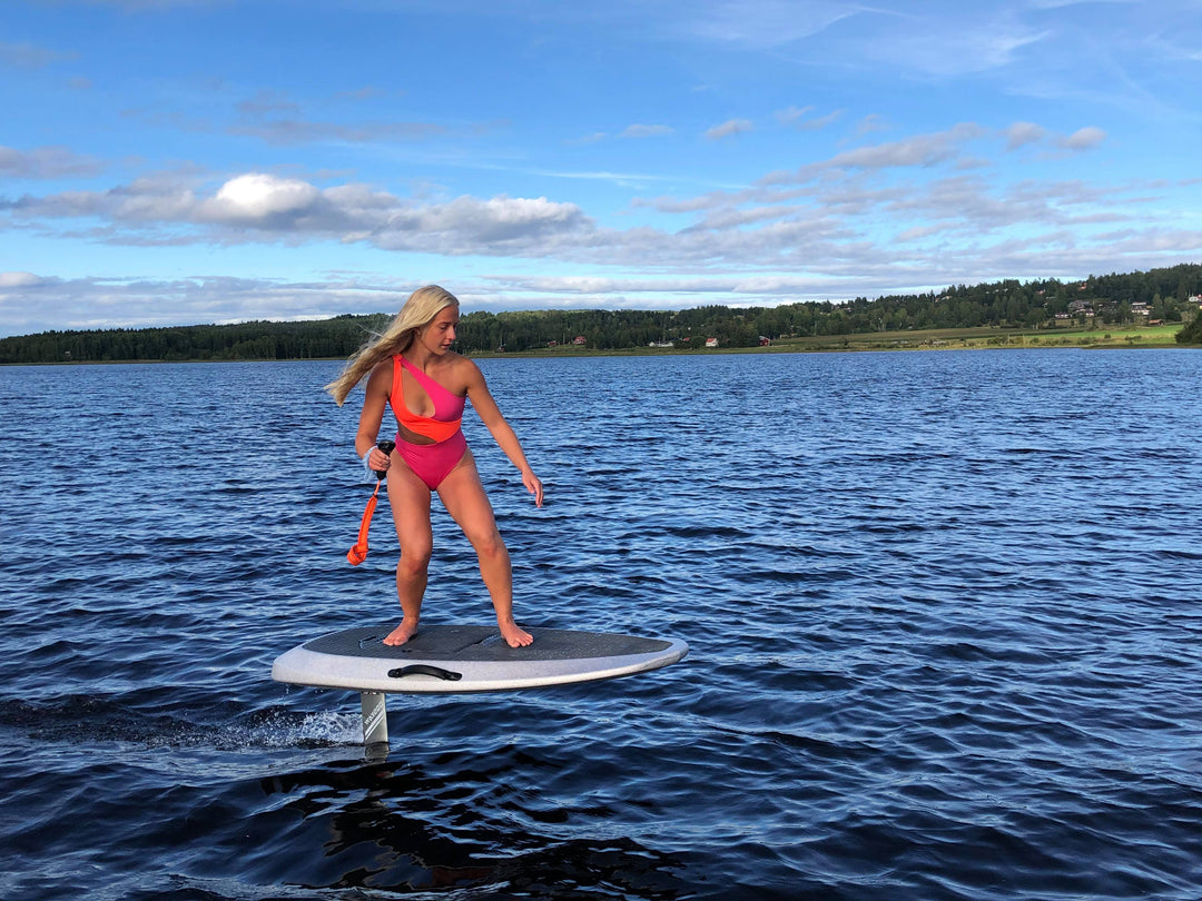 hot girl is riding a Waydoo efoil board in Sweden