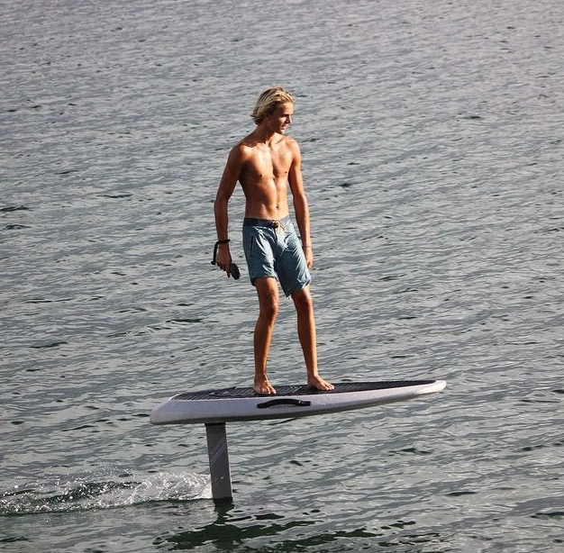 the young man is riding a waydoo efoil board on the sea